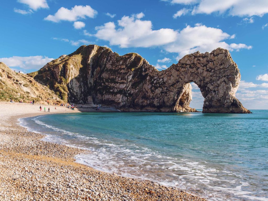 Durdle Door on a sunny day, a great dog-friendly walk from Lulworth Cove