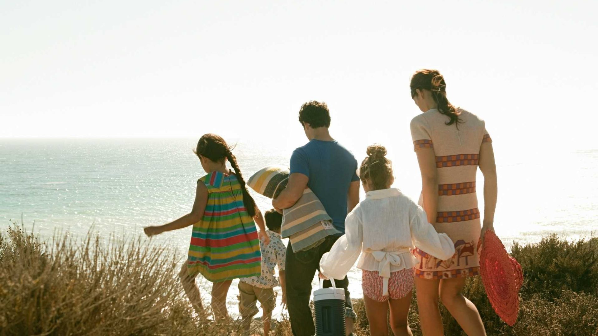 A family on the beach while staying at a Family friendly cottages in Dorset