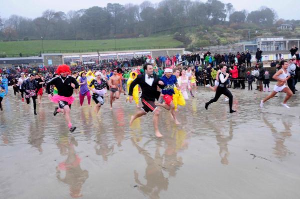people running into the doret sea at the lyme lunge in january