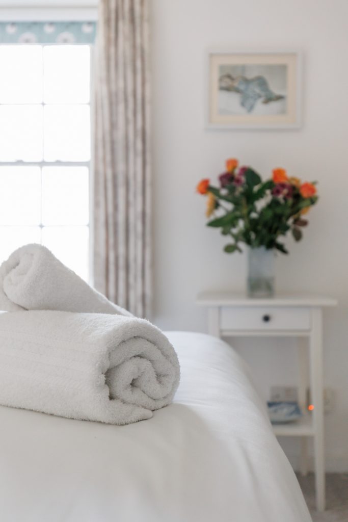 beautifully positioned towels in a holiday home