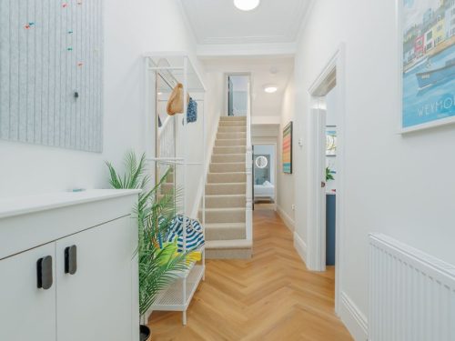 Stairway inside Beachway House holiday cottage connecting ground and upper floors