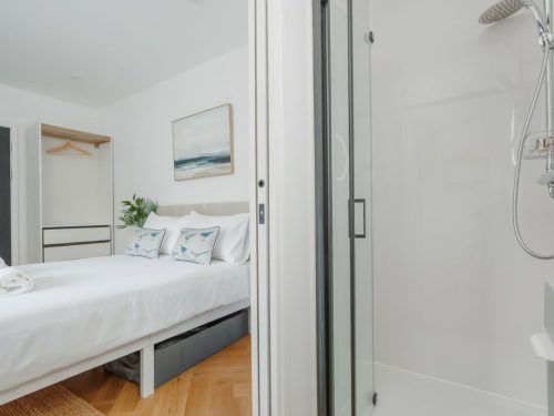 Double bed in bedroom at Beachway House holiday cottage