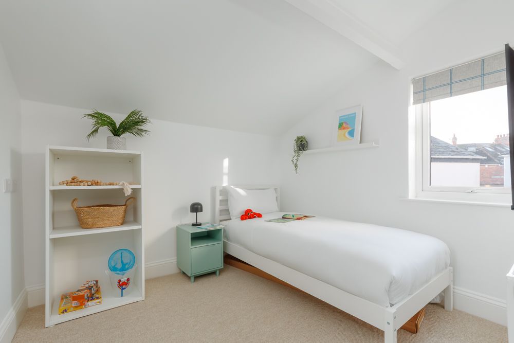 Single bed in bedroom at Beachway House holiday cottage