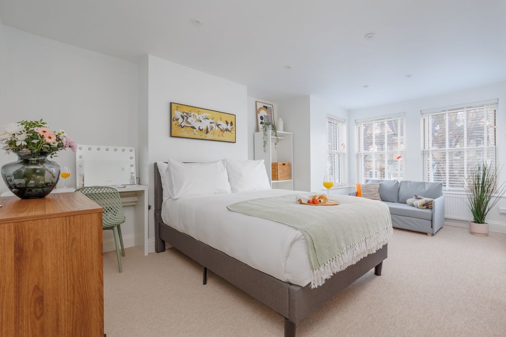Bedroom with forest sunset color palette, warm earthy tones, and soft natural lighting