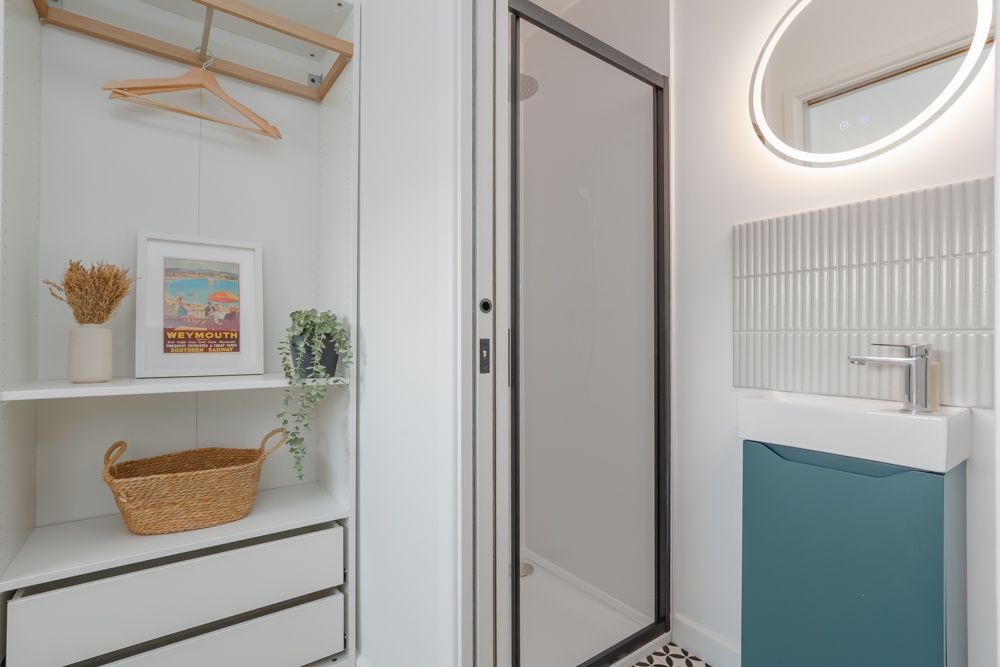 Shower with shelves in bathroom for storage and decor