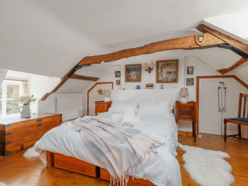 thatched cottage with beam ceilings