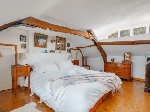 master bedroom in cosy thatched cottage